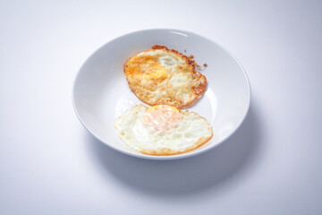 Fried egg with bread on white background. Thai style breakfast.