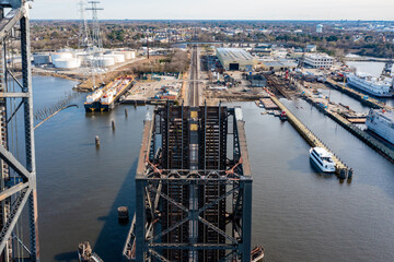 Aerial View of a Railroad Drawbridge Looking Towards a Shipyard and Industrial Warehouses in Norfolk Virginia