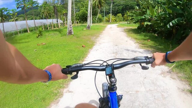 Biking around La Digue island on a sunny day, Seychelles