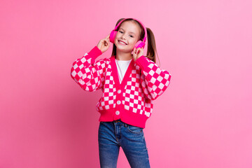 Photo of cheerful cute girl wear trendy outfit music lover listen nice song playlist isolated on...