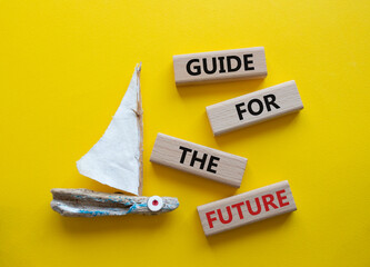 Guide for the future symbol. Wooden blocks with words Guide for the future. Beautiful yellow...