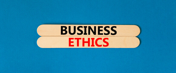 Business ethics symbol. Concept words Business ethics on beautiful wooden stick. Beautiful blue table blue background. Business ethics concept. Copy space.