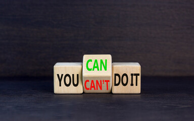 You can do it symbol. Concept word You can or can not do it on beautiful wooden cubes. Beautiful black table black background. Business and you can or not do it concept. Copy space.