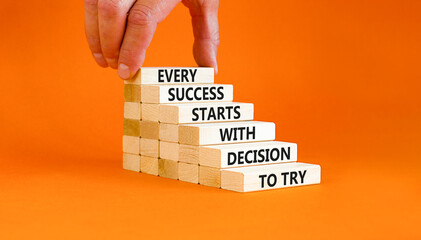 Success symbol. Concept words Every success starts with decision to try on wooden block. Beautiful orange table background. Businessman hand. Business success and decision to try concept. Copy space.
