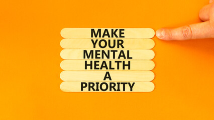 Mental health psychological symbol. Concept words Make your mental health a priority on wooden...