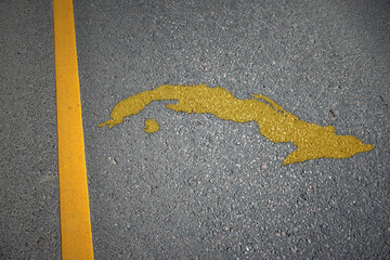 yellow map of cuba country on asphalt road near yellow line.