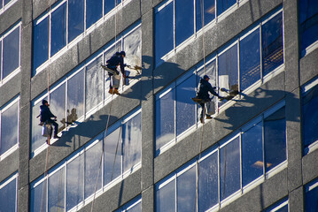 Window washers work high above the streets of Rosslyn, Virginia.