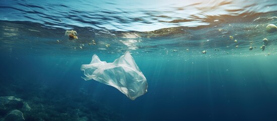 Plastic bags in the ocean cause an environmental crisis copy space image - obrazy, fototapety, plakaty