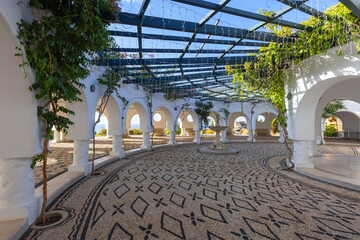 Kallithea Thermal Spa on the island of Rhodes. A white circular house standing at the foot of a hill.