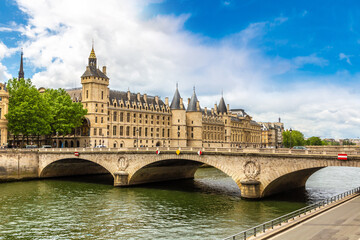 Pont au Change bridge over Seine river and Conciergerie palace and prison in Paris, France