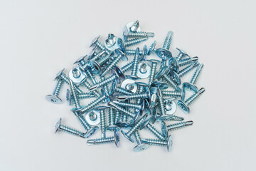 screws on a white background. photo of self-tapping screws for the catalog on a light background....