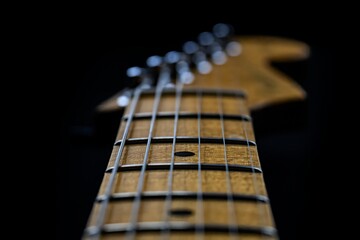 Fototapeta premium electric guitar neck close up, black background