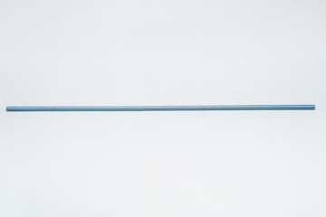iron threaded stud on a white background. metal rod with thread on a light background. construction long bolt with thread for fastening