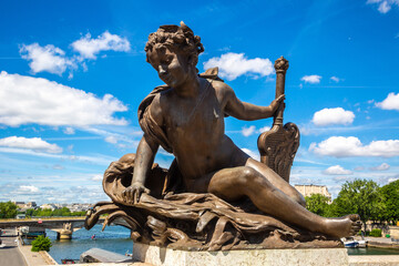 Fototapeta na wymiar Bronze sculpture on the Bridge Pont Alexandre III in Paris, France