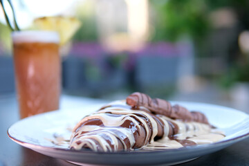 Close-Up of Chocolate Pancake with Banana and Strawberry Milkshakes. Sweet symphony of flavors...