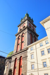 Fototapeta na wymiar Bell tower of Church of the Assumption of the Blessed Virgin Mary in Lviv, Ukraine