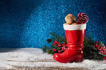 St. Nicholas Day. Red boot with sweets, spicy ginger cookies and gifts for December 6th