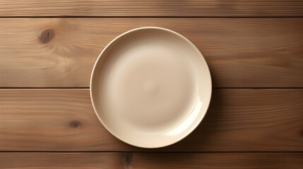 Fototapeta na wymiar Top View of an empty Plate in beige Colors on a wooden Table. Elegant Template with Copy Space