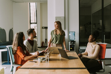 Young multiethnic startup team working in the modern office