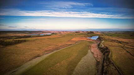 Scenic aerial landscape photo of the nature at Sycamore Gap, UK