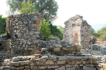 Ruins of the Great Basilica in Butrint National Park, Buthrotum, Albania. Triconch Palace at Butrint Life and death of an ancient Roman house Historical medieval Venetian Tower surrounded