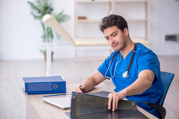 Young male doctor radiologist working in the clinic