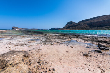 Panorama of the sea and the rock during a windy day at Blue lagoon in Balos, Crete, Greece. Beautiful lagoon at Mediterranean Sea. Shot taken near Gramvousa Island.
