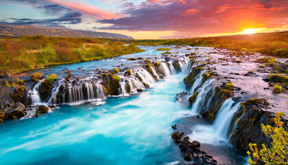 bruarfoss waterfall iceland fantastic south iceland with a colorful sunset an blue water iceland is a most popular place of travel travel is a lifestyle concept - obrazy, fototapety, plakaty