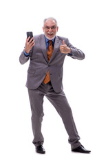 Old businessman talking by phone isolated on white