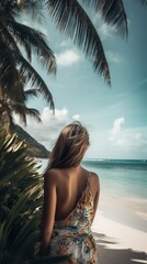 Young woman, view from the back, dressed in summer attire, stands on the beach. Coastal beauty, her hair dancing in the gentle breeze, captivated by the expansive view of the sea or ocean.