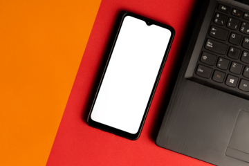 orange and grey background that contains a cell phone without a screen to fill and next to it a computer. PNG image.