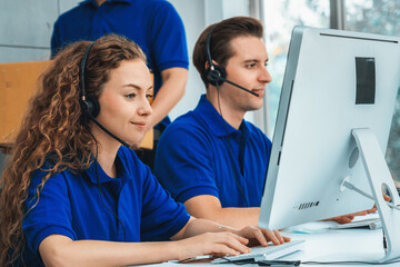 Business people wearing headset working in office to support remote customer or colleague. Call...