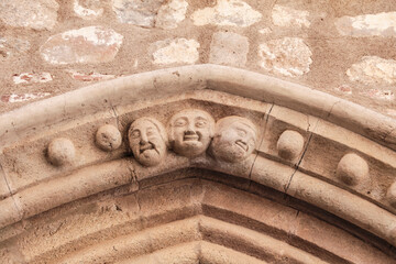 Carved stone details on facade in Trujillo town