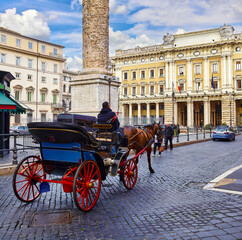 Rome, Italy. Horses in harness with coach for entertaining touristic strolls and city tours at...