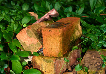 Old used house bricks in a garden