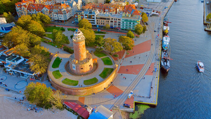 Port and lighthouse in Kołobrzeg, Poland. Photo taken with a drone at the beginning of autumn. The...