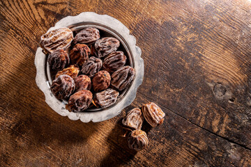 Dried persimmons on wooden table