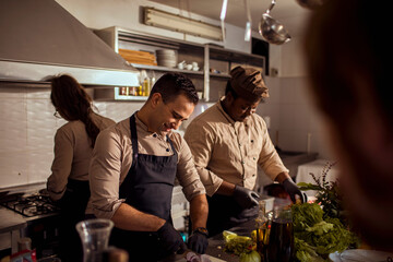 Young male chefs working in the kitchen