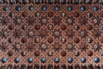 Flat view of decorated ceiling of cloister's corridor of Monastery of Saint John of the Kings in mudejar style, in Toledo, Spain