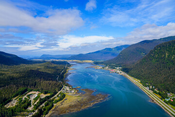Fototapeta na wymiar Panoramic view of the Gastineau Channel in Twin Lakes north of Juneau, Alaska - Fjord in the American arctic leading up to Juneau's International Airport surrounded by mountains