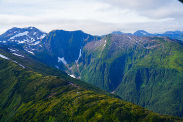 Fototapeta premium Aerial view of the snow-capped mountain summits east of Juneau, Alaska