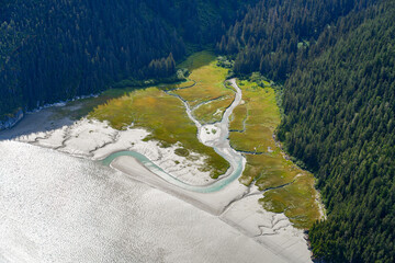 Aerial view of a melt water curvy river delta flowing into the Taku River east of Juneau, Alaska