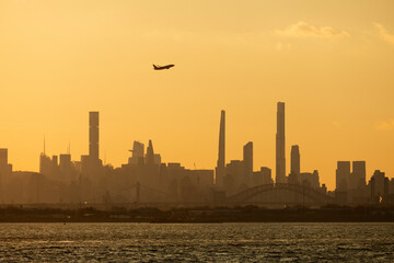 Airplane taking off from LaGuardia Airport with view of Manhattan skyline	
