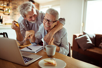 Elderly senior couple online shopping from home