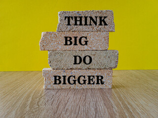 Success achievement concept written on a brick block. Beautiful wooden table, yellow background....