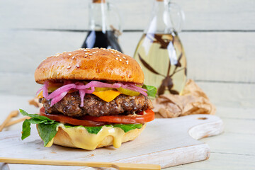 Delicious burger with beef meat, homemade bun and mayo