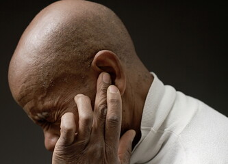 suffering from deafness and hearing loss on grey black background with people stock image stock...