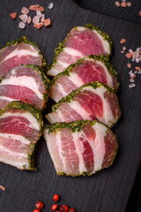 Delicious fresh bacon stripes with spices and salt