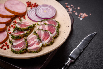 Delicious fresh bacon stripes with spices and salt