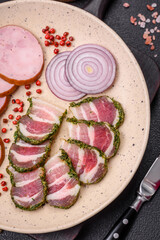 Delicious fresh bacon stripes with spices and salt